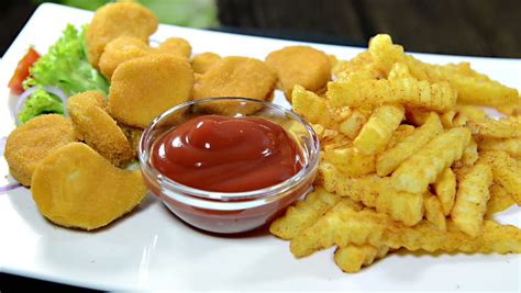 Chicken Nuggets With French Fries On A Plate (not Loopable Video) Stock Footage Video 6615683 ...