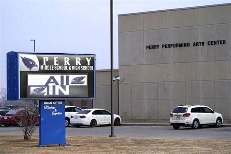 Iowa principal who risked his life to protect students during a high school shooting has died ...