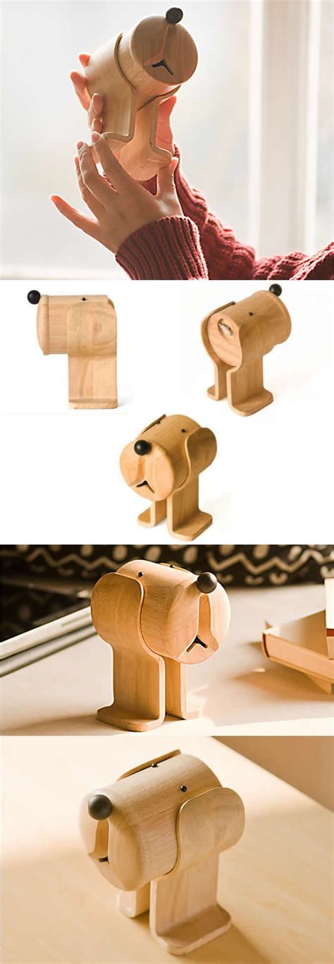 the wooden toy elephant is being held up by someone's hand and placed ...