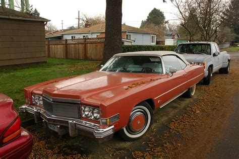 OLD PARKED CARS.: 1974 Cadillac Eldorado Convertible.