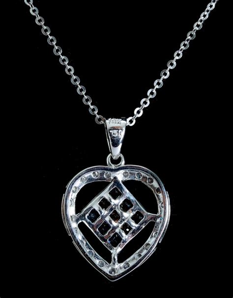 Lot - 18k White Gold Diamond & Sapphire Heart Pendant