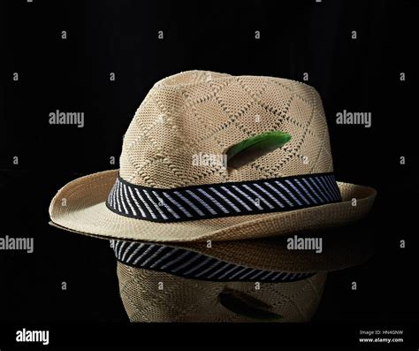 hat with green feather isolated on black background Stock Photo - Alamy