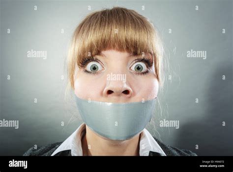 Woman mouth taped shut afraid hi-res stock photography and images - Alamy