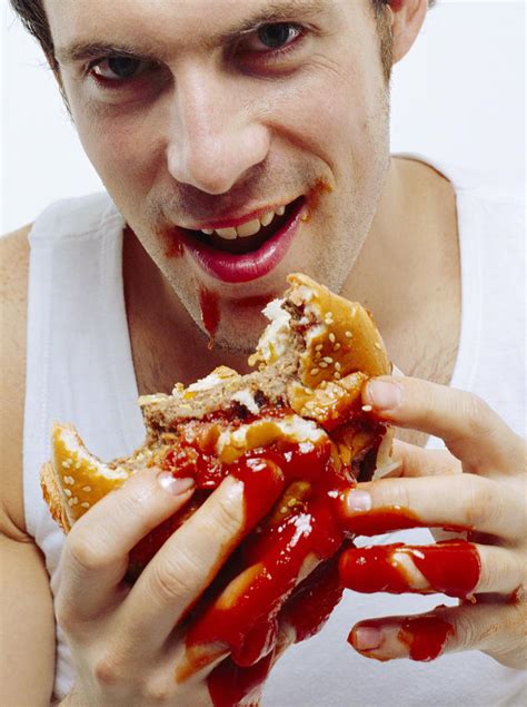 Man Eating Burger Photograph by Jason Kelvin/science Photo Libray | Pixels