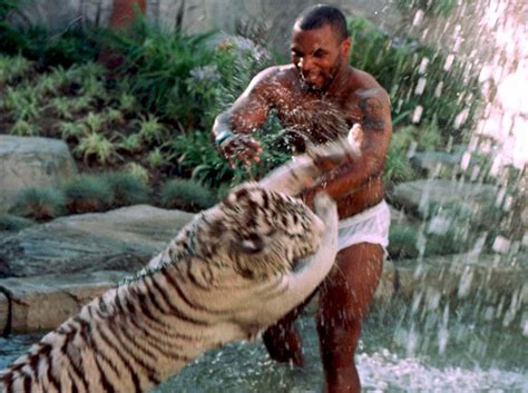 Mike Tyson Chokes Bengal Tiger in Throwback Photo - EssentiallySports