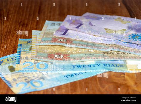 The Riyal Currency of the Oman notes spread out on the table. Money exchange Stock Photo - Alamy