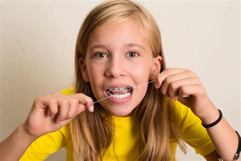 How to Floss with Braces: A Guide for Kids - Weiss & Tor Orthodontics