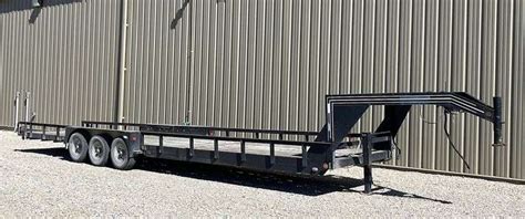 Homemade 34' gooseneck flatbed trailer - Schneider Auctioneers LLC