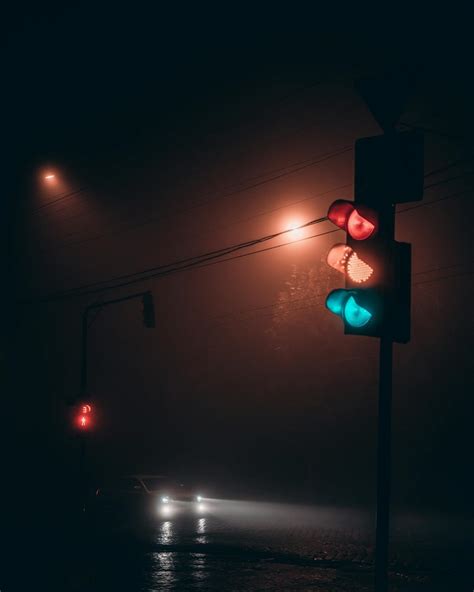 Traffic light on road at night · Free Stock Photo