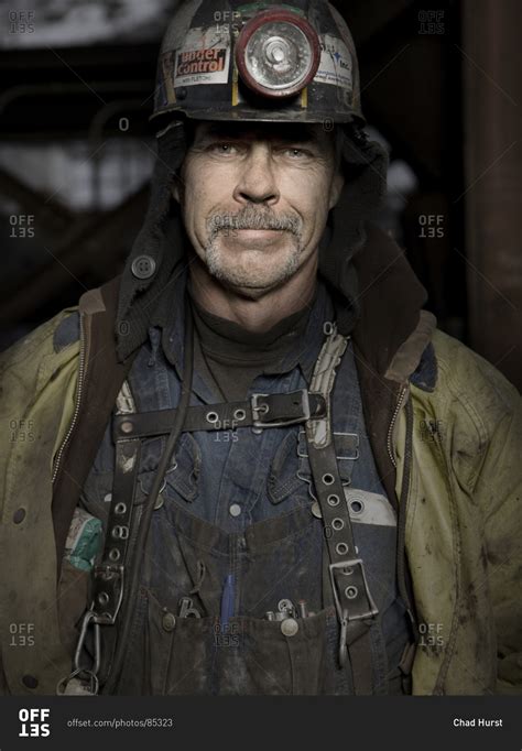 Portrait of a happy coal miner stock photo - OFFSET