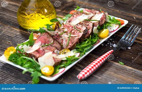 Beef Tagliata with Arugula stock photo. Image of tagliata - 64935244