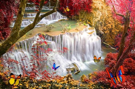 Deep forest Waterfall with artificial butterfly — Stock Photo © kwanchaidp #78664568