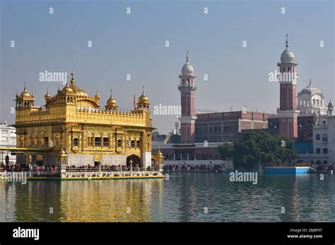 Harmandir Sahib rises out of the holy Pool of Nectar with towers of ...