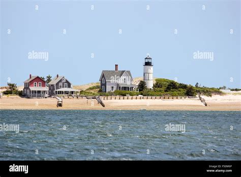 Sandy Neck Beach's old cottage colony and Sandy Neck Lighthouse seen ...