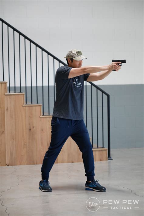 How to Shoot a Pistol Accurately [Ultimate Guide] | Tactical life, Shooting poses, Poses