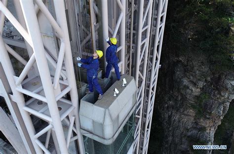 Mechanic conducts routine checks to guarantee cliffside elevator's safe operation - Xinhua ...