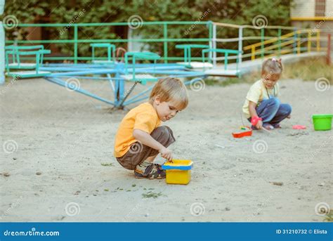 Kids Play In The Sand Box Stock Photography - Image: 31210732