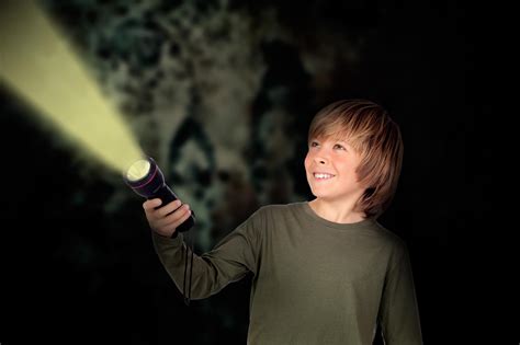 Child with a flashlight looking for something - Walking The Parks