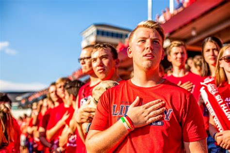 Liberty University student section dresses up in red for the football ...