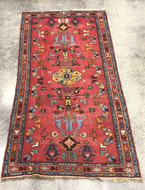 Lot - Persian Floral Motif Hand Woven Wool Rug