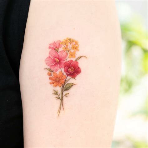 Share 81+ cosmos and marigold flower tattoo super hot - in.coedo.com.vn