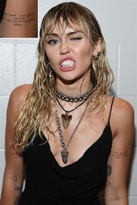 Miley Cyrus Debuts New Breakup Tattoo on Stage at the VMAs After Liam Hemsworth Files for ...