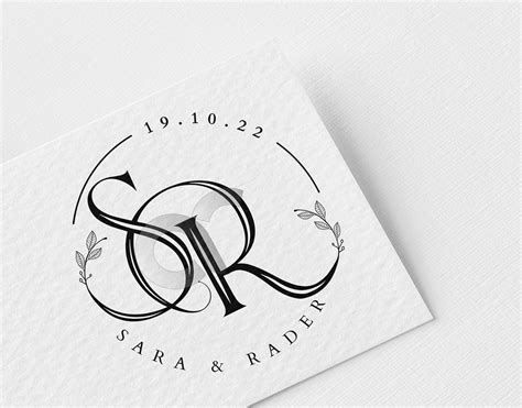 a white business card with the letter s in black and white on top of it