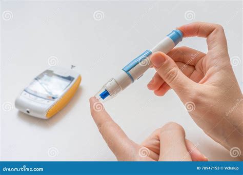 Diabetic Patient is Using Needle and Glucometer To Check Blood Glucose ...