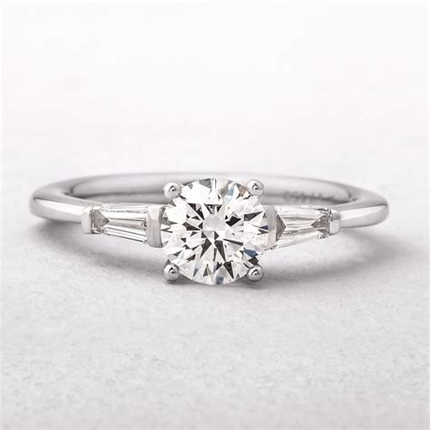 Platinum Solitaire With Tapered Baguette Side Diamonds