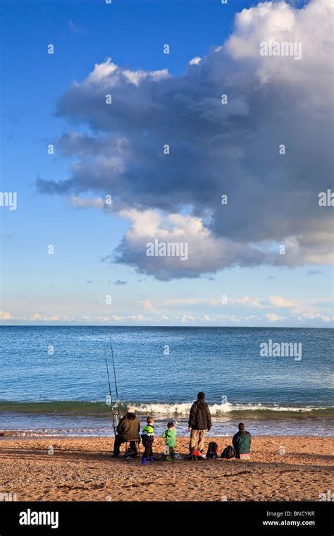 Family fishing on the beach at Slapton Sands, Devon in Summer Stock Photo - Alamy