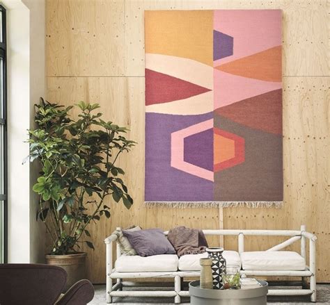 Using Rugs as Wall Art: Hanging Interior Design Trend