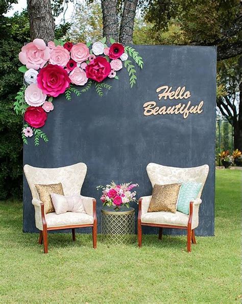 Wedding backdrop with arm chairs | Flower wall wedding, Paper flower wall wedding, Paper flowers ...