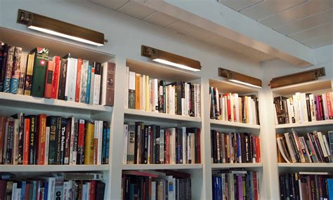 library lights over the bookcases, Nell Hills | Bookcase lighting, Bookcase, Bookshelf lighting