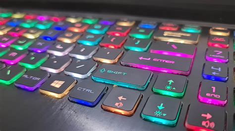 A gaming keyboard that has colorful LED lights, with the main color of ...