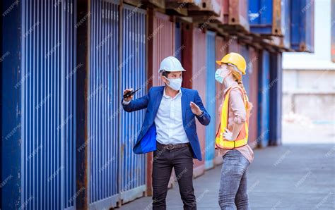 Premium Photo | Portrait team dock workers posing under working and ...