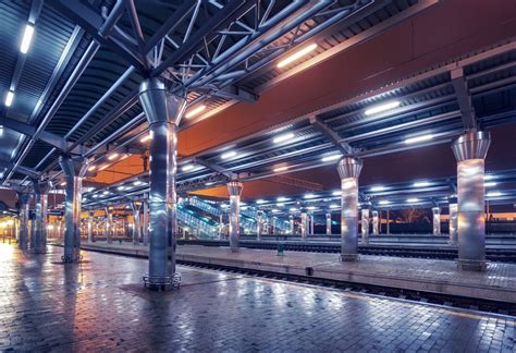 Railway station at night. Train platform in fog. Railroad | LightSpectrum