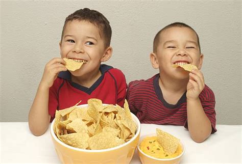 Best Kid Eating Chips Stock Photos, Pictures & Royalty-Free Images - iStock