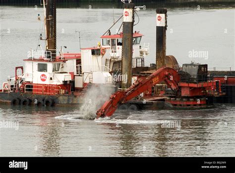 dredger with digger Stock Photo - Alamy