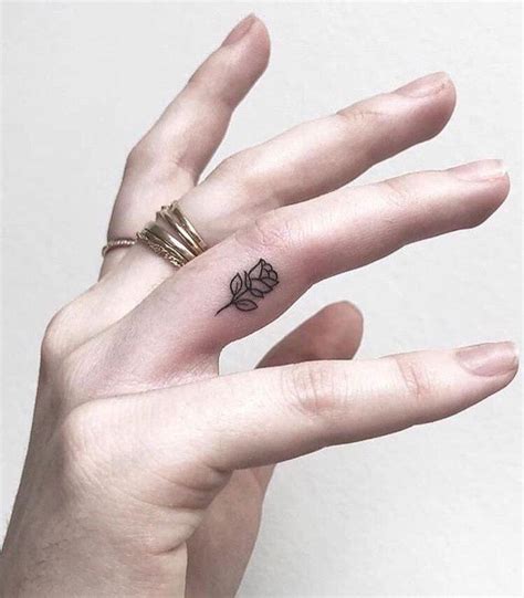 finger tattoo little rose | Tiny Tattoo inc.