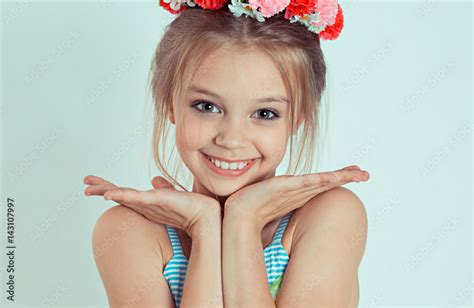 Sweet smile. Close up Cute happy teen girl standing with hands fingers ...