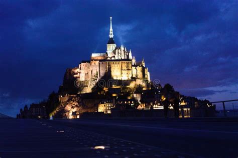 Mont Saint-michel At Night Lit Up From The Walkway Centered Image Stock Photo - Image of ...