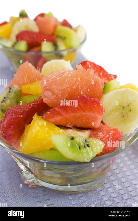 Fruit salad on a white background close-up Stock Photo - Alamy