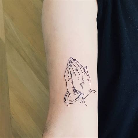 Praying hands tattoo inked on the right arm by Rhys Pieces Small Chest ...