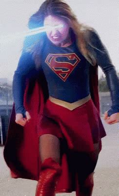 a woman in a superman costume is walking