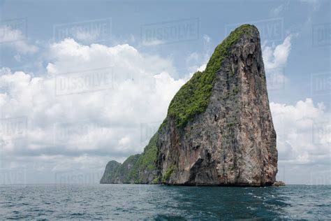 Large rock formation in ocean - Stock Photo - Dissolve