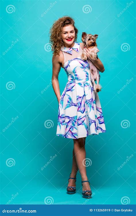 Young Woman with Small Dog Yorkshire Terrier Stands in Full Height ...