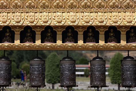 Young boy making the prayer wheels of Dirang monastery turn | Dirang monastery | Dirang | Travel ...