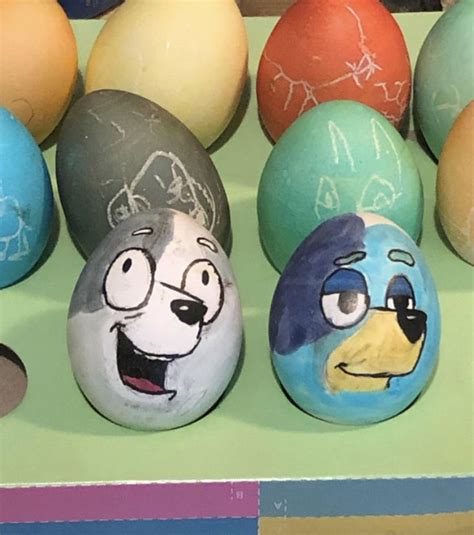 several painted eggs with faces on them