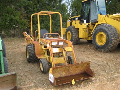 TERRAMITE T5C LOADER BACKHOE - J.M. Wood Auction Company, Inc.