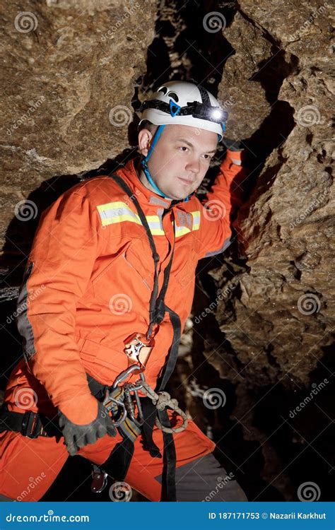 Speleologist Descend by the Rope in the Deep Vertical Cave Tunnel. Cave ...